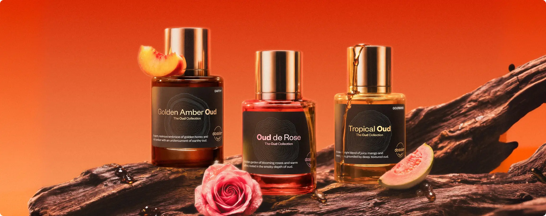 Dossier Oud Collection perfumes with fruit and floral accents on a warm orange background.